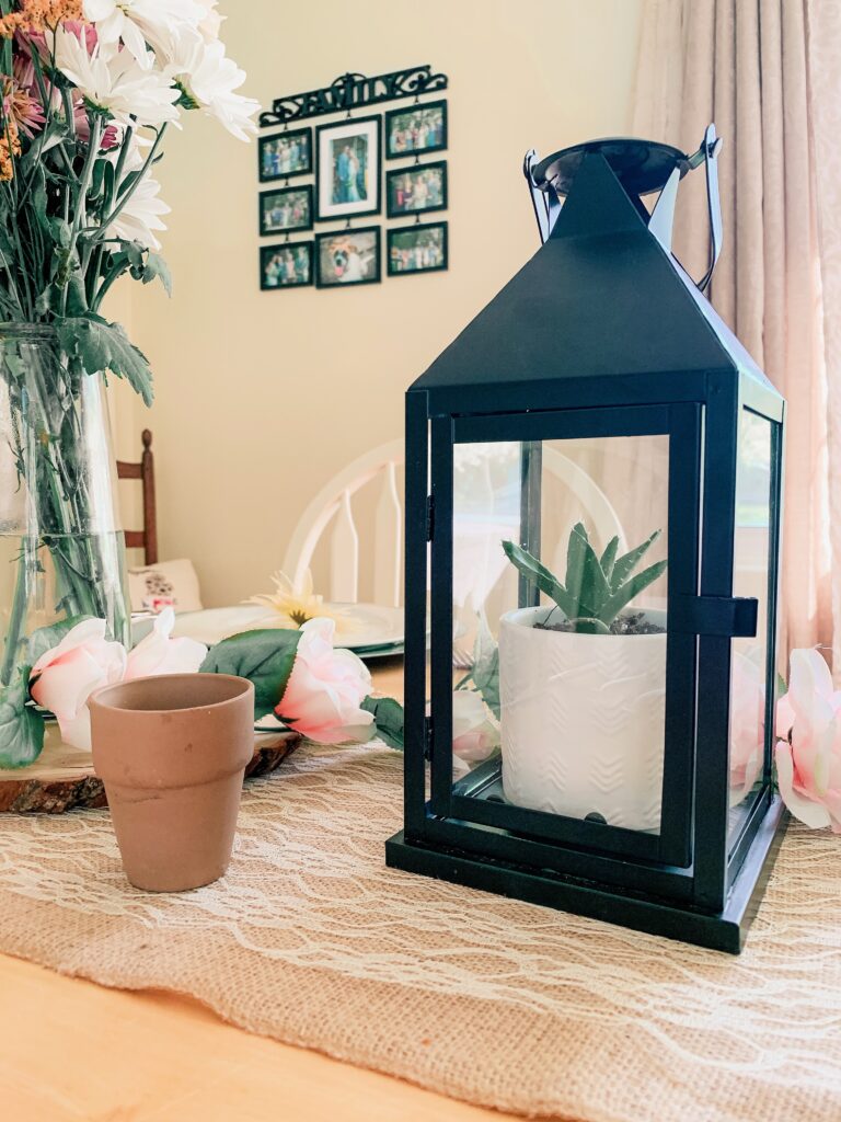 Spring tablescape with a succulent in a lantern.